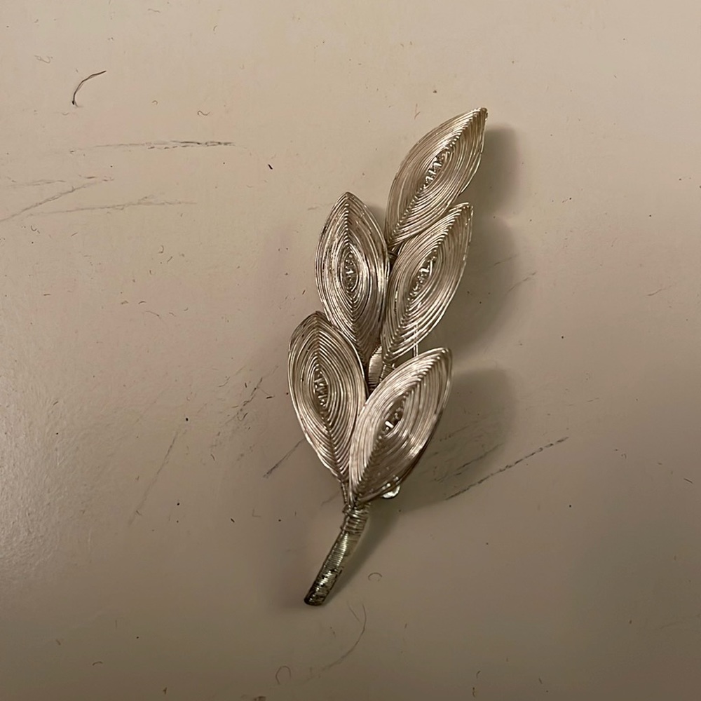 Beautifully hand made, wrapped silver wire brooch, leaves can be gently moved.